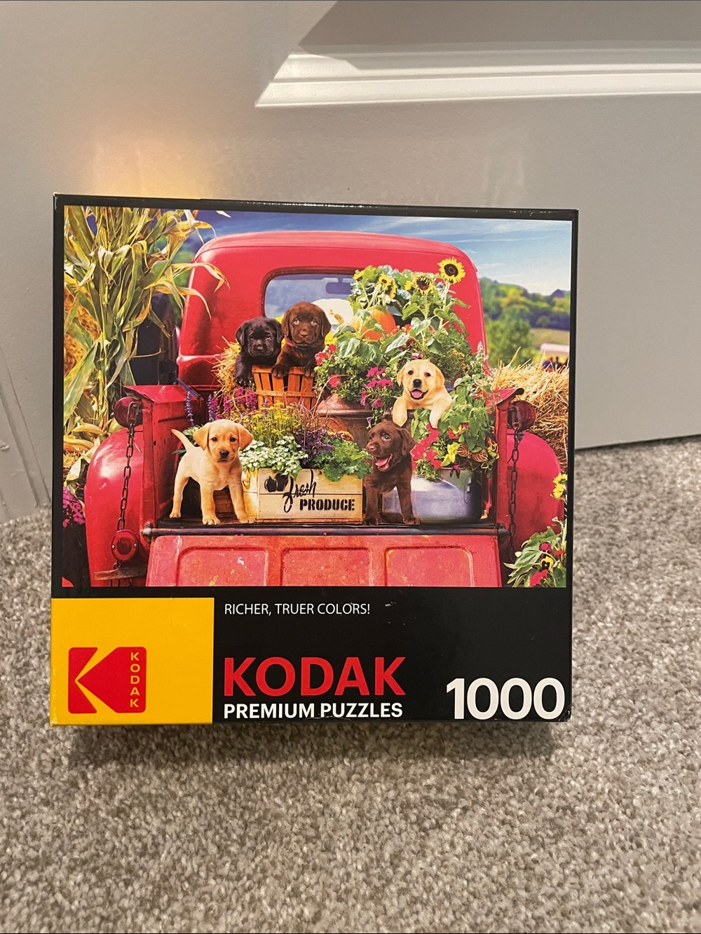 Kodak Red Truck Filled with Colorful Flowers and Puppies Puzzle